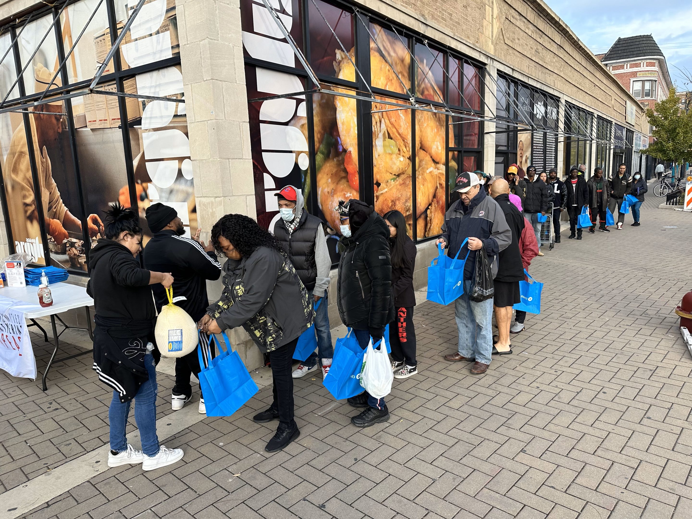 people in line waiting for turkeys