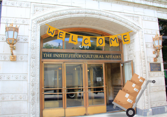 a set of doors with a welcome banner and moving boxes